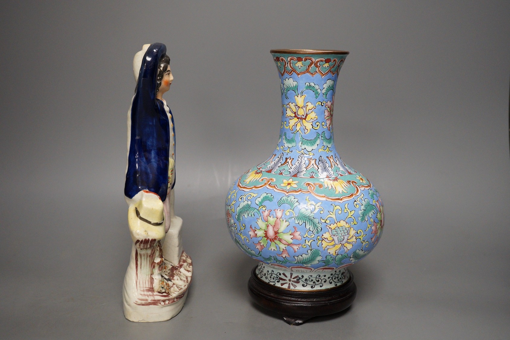 A Chinese canton enamel vase, wood stand, 23.5cm tall